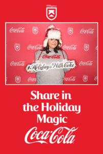 Photo booth picture of a women holding a #HolidaysWithCoke sign in the Coca-Cola Killington branded backdrop photo booth with a Share in the Holiday Magic frame