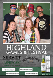Group posing with props on a Laphroaig Whiskey branded backdrop photo booth with a custom Highland Games & Festival frame