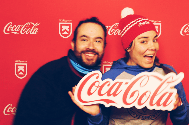 Gif of a couple posing with a Coca-Cola sign on a Coca-Cola Killington branded backdrop photo booth