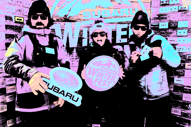 Gif of 3 people in snow gear in a Subaru branded photo booth with a pastel filter
