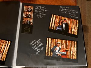 Guestbook full of photo booth images and personal notes written below